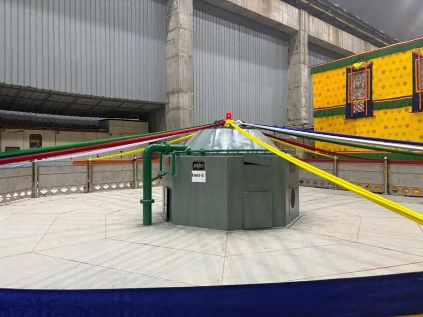 Powerhouse interior of Punatsangchhu-II Hydroelectric Project showing BHEL-installed turbine unit with cables for synchronization to Bhutan’s grid.