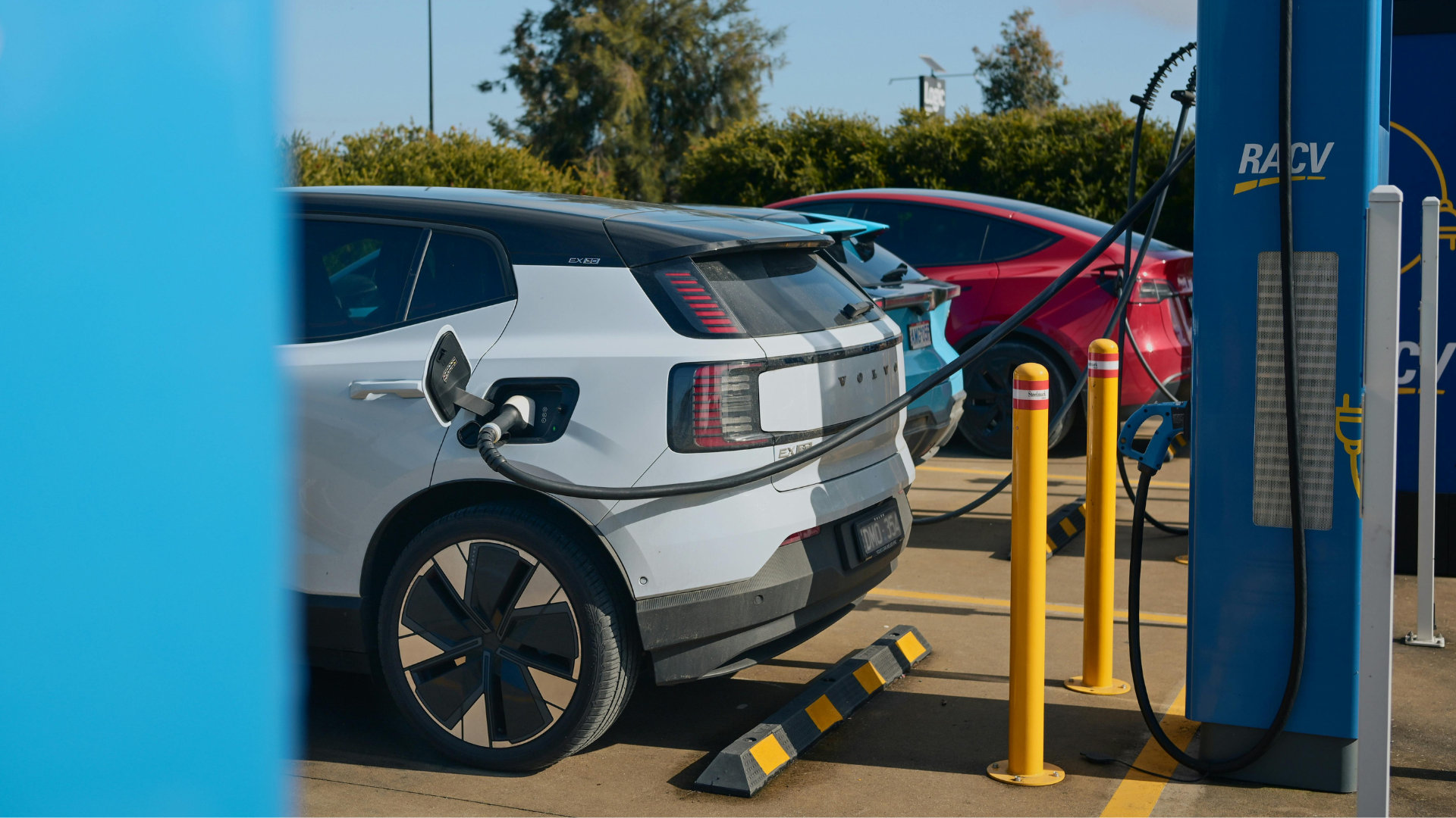 Electric cars charging at a public charging station.