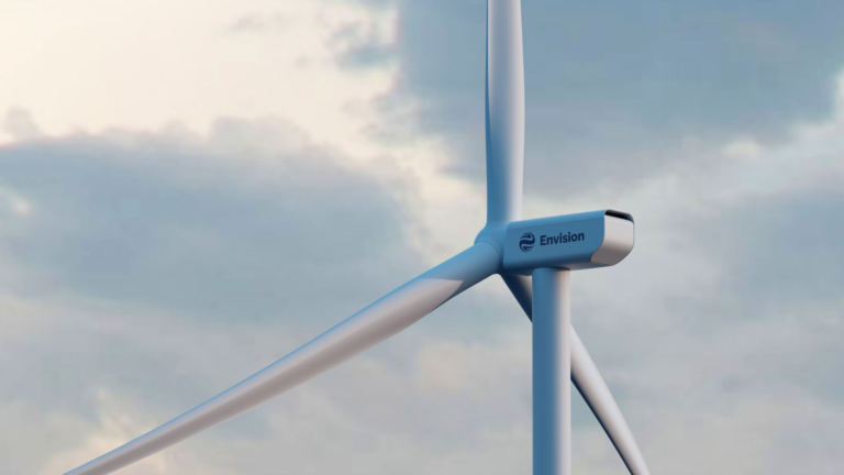 Close up of wind turbine with Envision written on it.