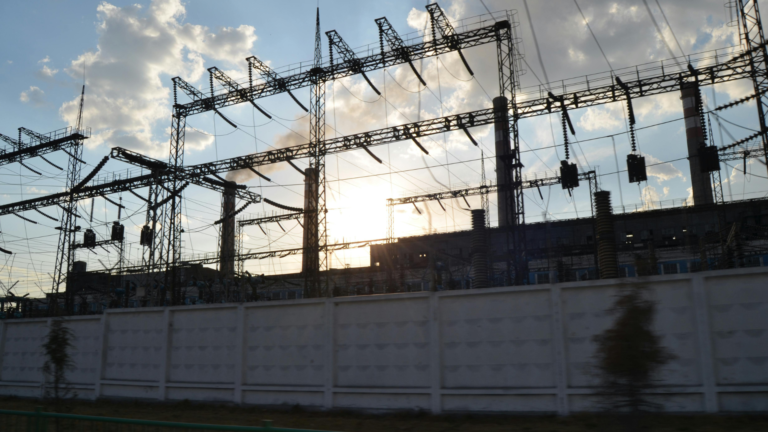 transmission structures and equipment at sunset