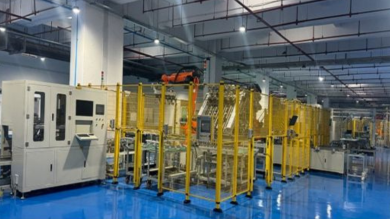 Interior view of GoodEnough Energy’s battery energy storage system manufacturing line at its Noida facility, showing automated equipment and assembly units.