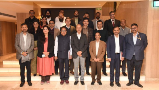 Group photograph of officials, experts, and industry representatives attending the India Energy Stack Taskforce review meeting under the Ministry of Power, discussing Version 0.3 of the IES strategy and architecture documents.