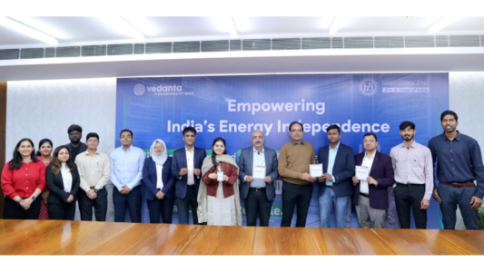 Hindustan Zinc and JNCASR representatives pose with zinc-ion battery pouch cell prototypes at a research collaboration event in India.