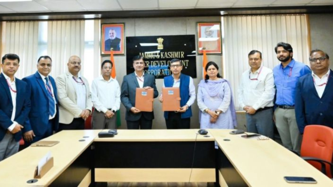 Officials from NHPC and Jammu & Kashmir State Power Development Corporation Limited display signed agreement documents during the March 27, 2026 signing ceremony in Jammu for the Uri-I Stage-II (240 MW) and Dulhasti Stage-II (260 MW) hydroelectric projects.