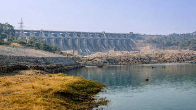 concrete dam over calm river