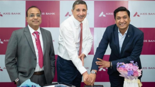 Axis Bank executives during the announcement of a financing partnership with Tesla to provide customised EV loan solutions for Tesla vehicle buyers in India.