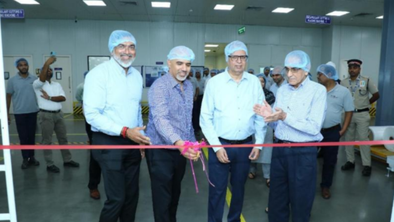 Nandkumar Pai, Saif Dhorajiwala, Avinash Hiranandani, and Ashok Lakhani cutting the ribbon at the inauguration of RenewSys India's 3 GW solar module manufacturing facility in Khopoli, Maharashtra