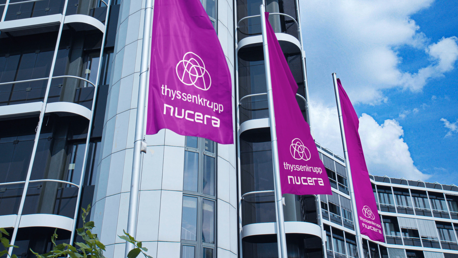 thyssenkrupp nucera branded flags flying outside the company's corporate headquarters in Dortmund, Germany