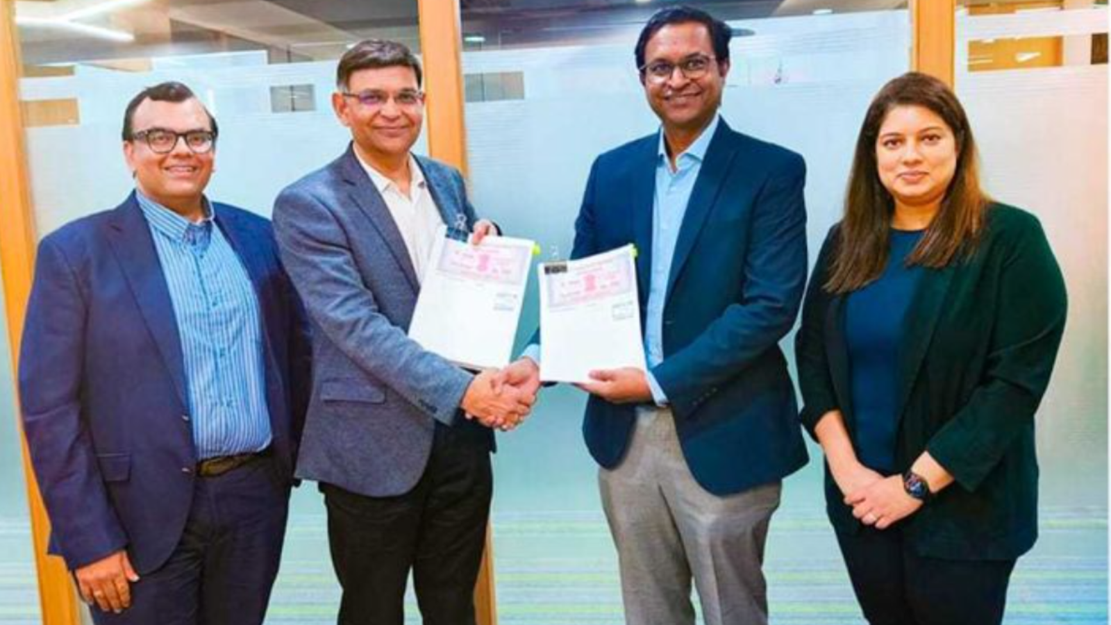 Tata Power Renewable Energy Limited officials exchange documents with Pune IT City Metro Rail Ltd representatives after signing the LOA for a 7.67 MWp rooftop solar EPC project