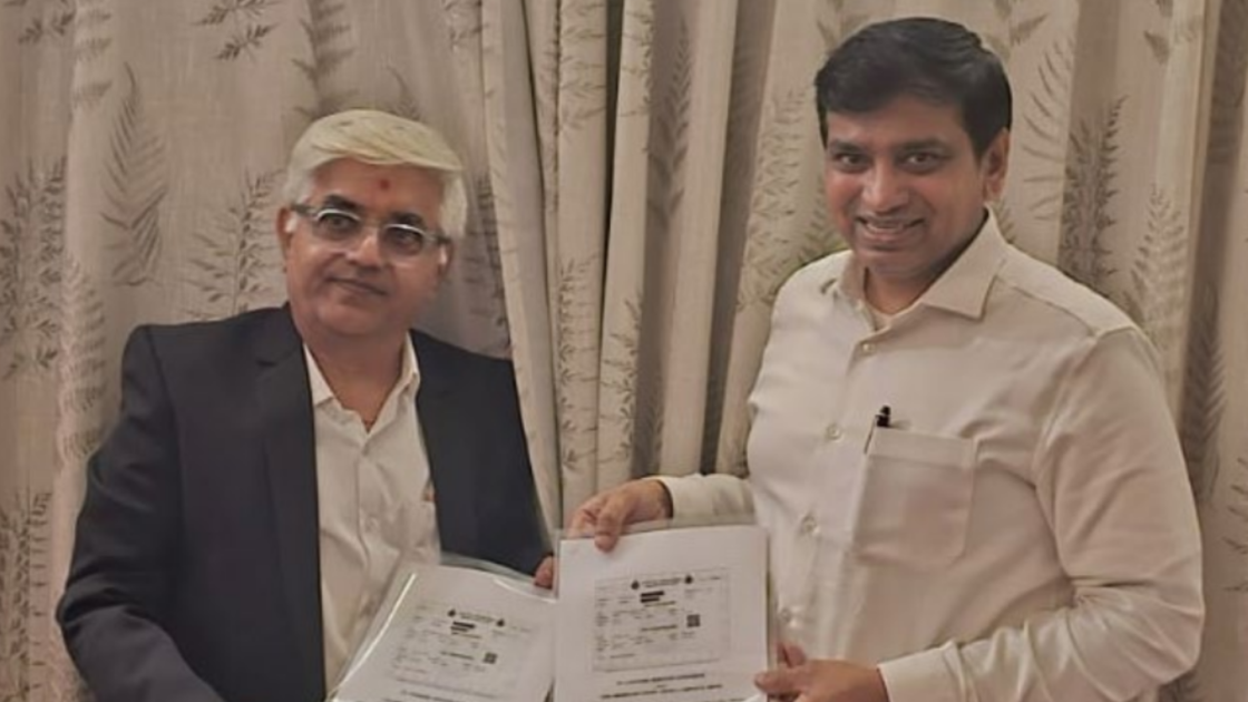 Representatives from Ampvolts Limited and partners display signed project documents for EV charging hub deployment initiative in India