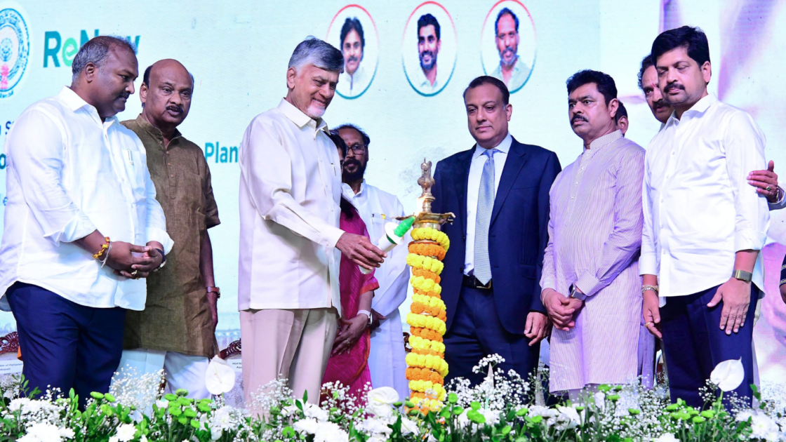 Andhra Pradesh Chief Minister N. Chandrababu Naidu inaugurates ReNew’s solar manufacturing project at Rambilli, alongside officials and company representatives during a ceremonial lamp lighting.