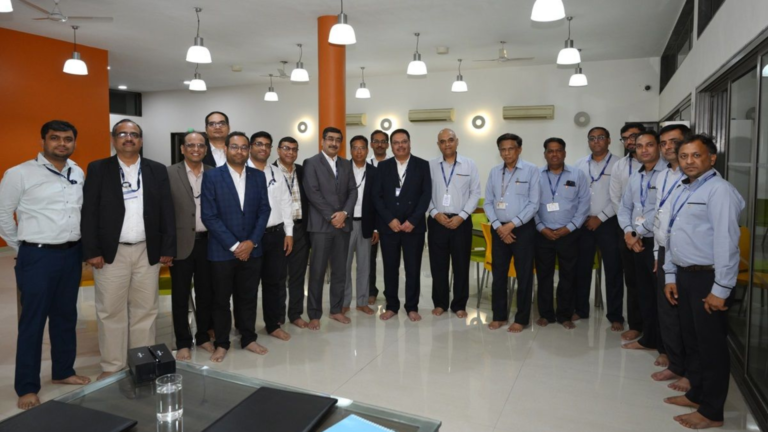 Group of Andritz and Torrent Power officials standing together during a site or project meeting related to the Saidongar pumped storage project in Maharashtra.
