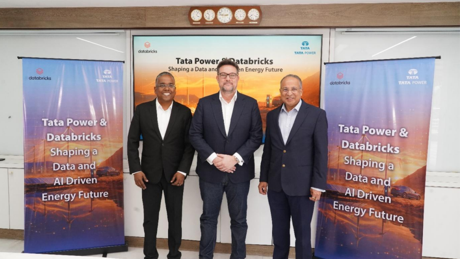 Tata Power and Databricks executives pose at a partnership event announcing enterprise AI and data platform deployment for energy operations, including renewables and grid management.