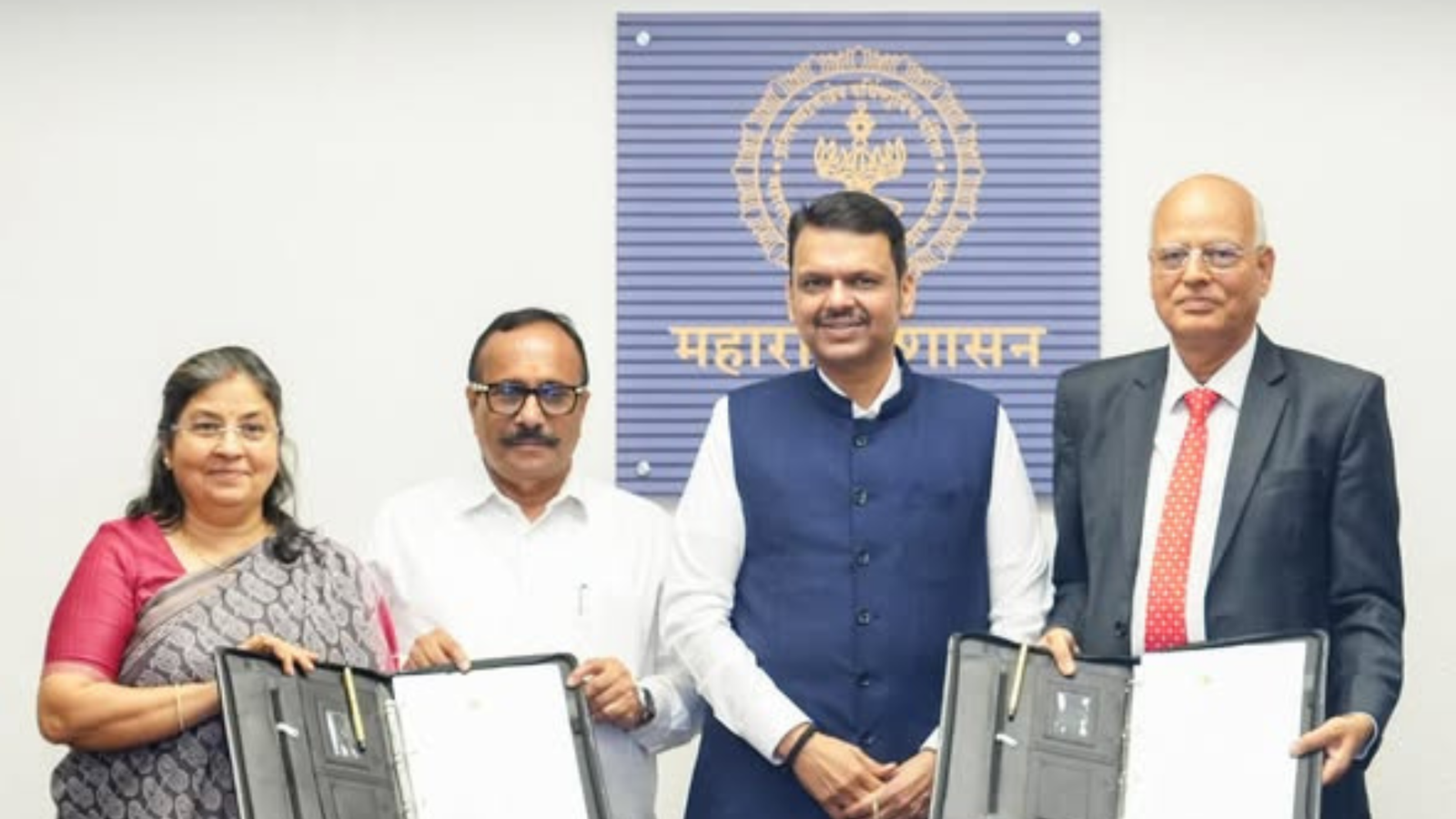 Maharashtra Chief Minister Devendra Fadnavis with officials and company representatives during the signing of MoUs for nuclear power projects in Maharashtra.