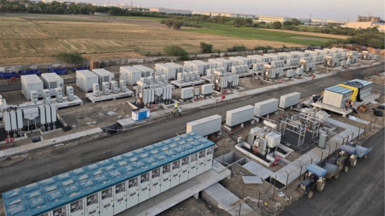 Aerial view of IndiGrid’s 180 MW/360 MWh battery energy storage system project in Gujarat with battery containers, transformers, and grid infrastructure installed at the site.