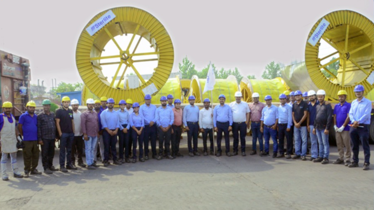 Sterlite Electric team members stand beside large cable drums carrying 220 kV XLPE-insulated power cables during the flag-off of the company's first export shipment to Sri Lanka for a transmission substation project in Colombo.