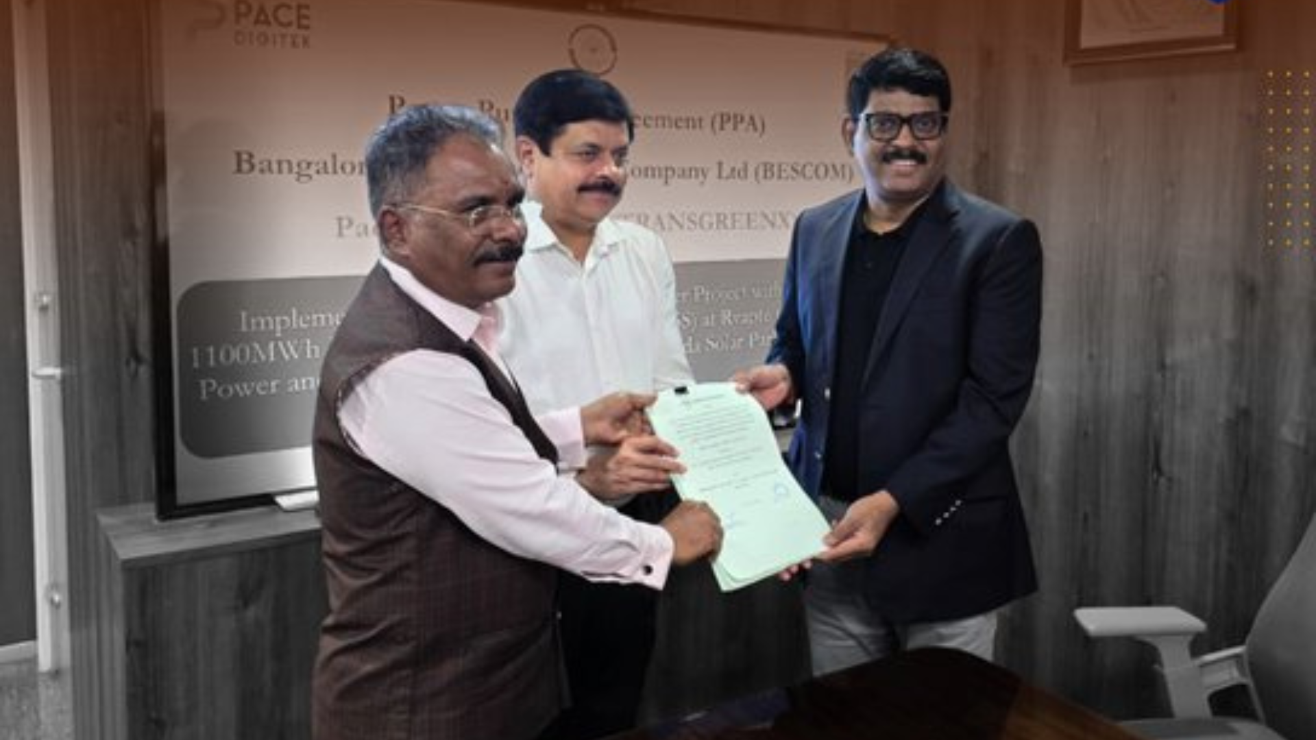 Representatives of Pace Group and BESCOM exchange documents during the signing of the power purchase agreement for the 250 MW solar and 1,100 MWh battery energy storage project at Pavagada Solar Park in Karnataka.