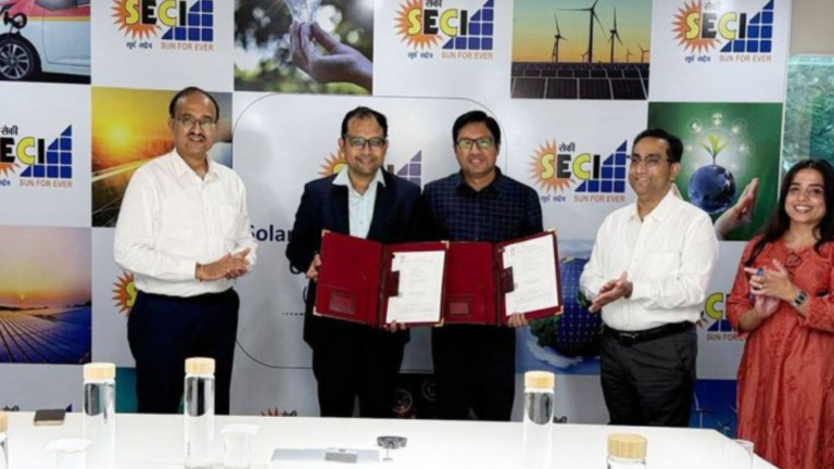 Representatives of SECI and Acme Cleantech Solutions exchange signed documents during the signing of a 700 MW Commercial and Industrial (C&I) renewable power term sheet at SECI's office, with officials from both organisations present.
