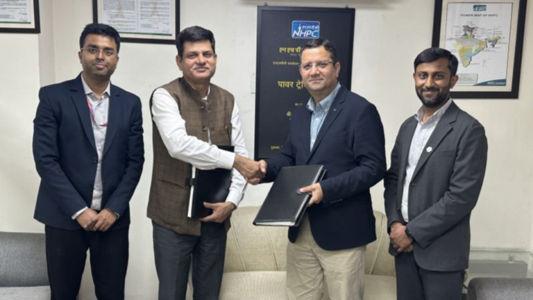 Officials from Hexa Climate and NHPC exchange documents during the signing of a power purchase agreement for a 160 MW Firm and Dispatchable Renewable Energy (FDRE) project in New Delhi.