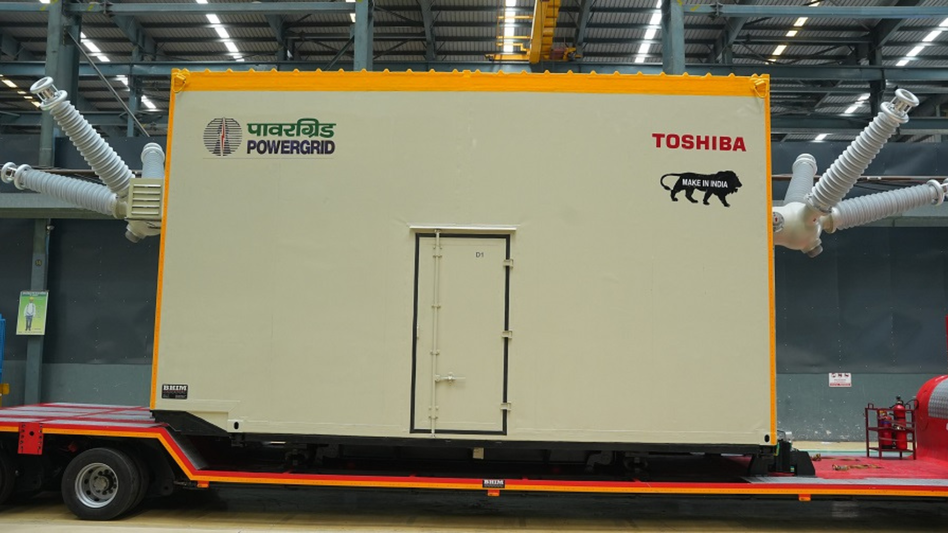 Graphic featuring the logos of POWERGRID and Toshiba alongside the Make in India icon, representing Toshiba's delivery of an indigenously developed 132kV mobile gas-insulated switchgear system to Power Grid Corporation of India Limited, reinforcing grid modernization and local manufacturing.