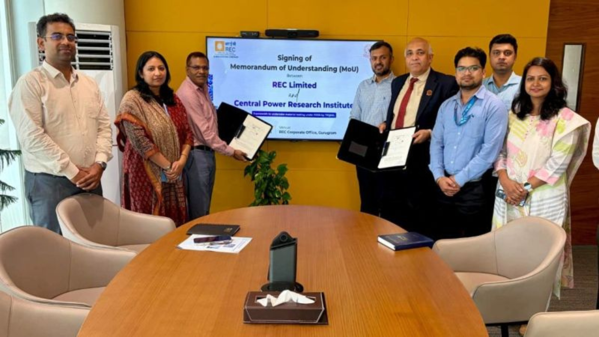 Officials from REC Limited and the Central Power Research Institute (CPRI) pose after signing a Memorandum of Understanding at REC's corporate office in Gurugram to strengthen quality testing, technical support and quality assurance for materials deployed under the Revamped Distribution Sector Scheme (RDSS).